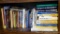 Shelf of books with a variety of subjects including health and healing, home improvement, cooking,