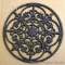 Interesting cast metal trivet or wall hanging; measures 12