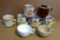 Variety of coffee mugs with 4 matching.