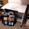 Drafting or crafting table has a tiltable top and side trays. Table measures 24
