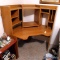 Corner style work station or desk has a lot of storage and seems in good shape. Approx. 5' across