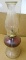 Nice footed glass oil lamp is 18