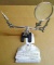 Handy little magnifying work station has a cast iron base and alligator clips for holding little