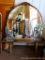 Vintage round vanity mirror has a carved accent at top and bottom trim of mirror. Three mirrored