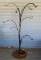 Nice shepherd hook style tree would hold lots of bird feeders or flower pots! Stands about 62