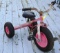 Clarke tricycle has wagon hitch and looks like it?s ready for some fun. Tires hold air, measures