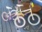 Huffy and Kent kids bicycles and a pair of training wheels. Larger bike is about 51