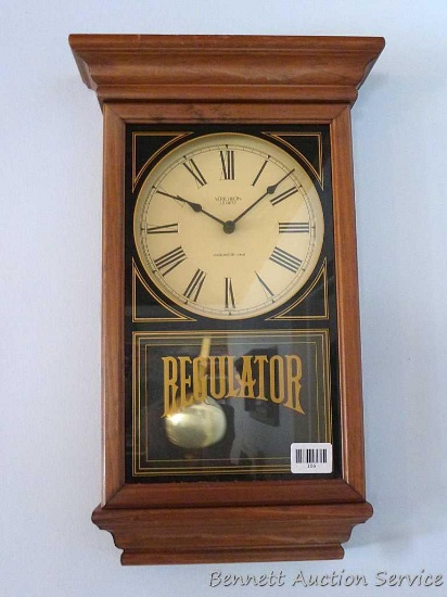 Nice wall clock by Verichron has a Westminster chime. Case measures 14" wide x 22-1/2" high.