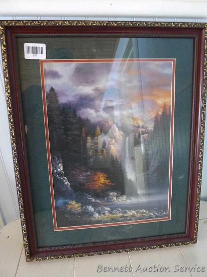 Framed and matted waterfall scene signed by James Lee is 18" x 22".