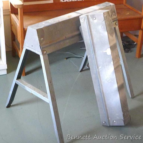 Pair of metal folding saw horses, each 31" long.