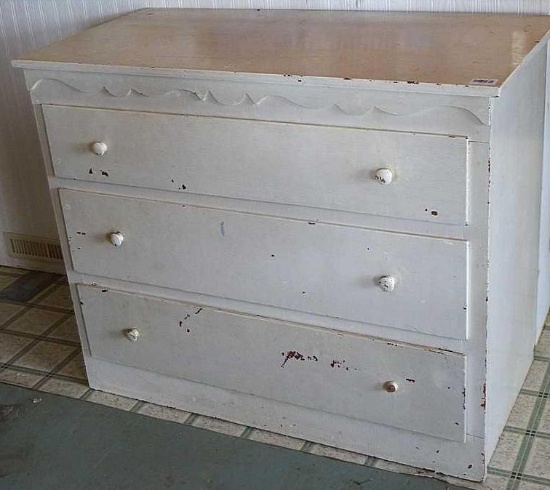 Sturdy wooden three drawer dresser is 42" wide x 21" deep x 34" high.