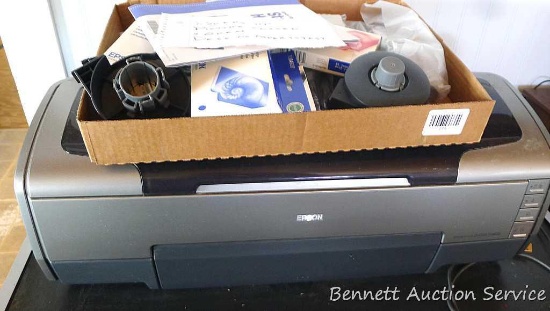 Epson Stylus Photo R1800 printer is 24" x 12" x 9". Comes with misc. parts, cords, ink and start up