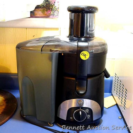 General Electric juicer; measures 12' X 7" X 15-1/2" Tall. Juicer runs and comes apart easily for