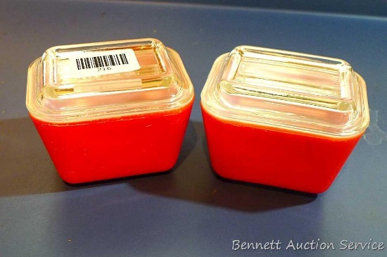 Two red Pyrex small size refrigerator dishes with lids. Good condition.
