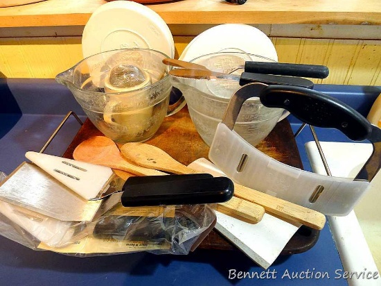 Pampered Chef pizza stone with rack, wooden spoons, 4 cup batter bowls with lids, pie slice/server,