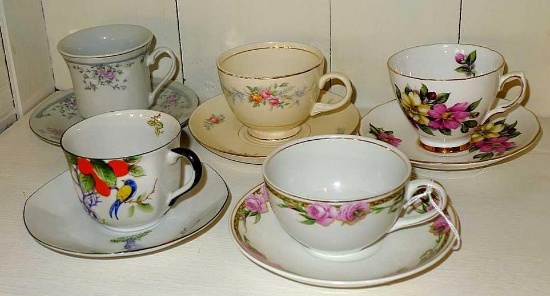 Collection of 5 different teacups and their matching saucers.