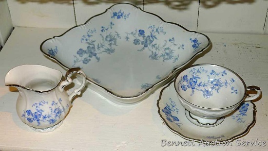 Pretty blue floral printed serving bowl with matching creamer and cup and saucer; all stamped