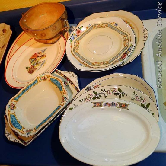 Collection of different sized plates and small platters and bowl; largest bowl with handles measures