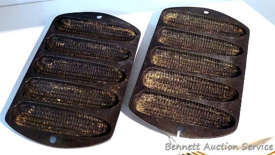 Two cast iron corn bread stick pans in good shape. Each measures 5-1/2" x 9".