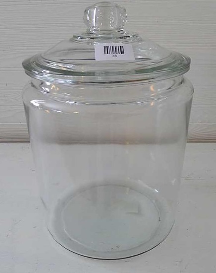 Large heavy glass canister type container is 13-1/2" x 9".