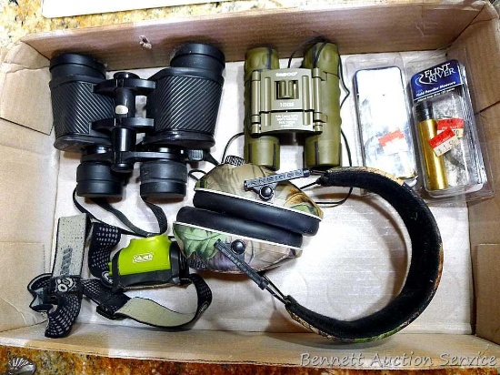 Two pair of Tasco binoculars; Radians shooting muffs; two Flint River powder measures are new in
