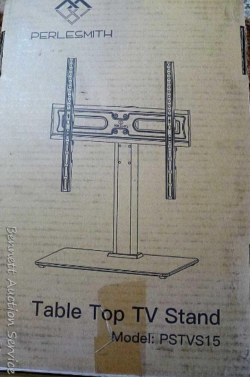 New in package Perlesmith table top TV stand with instruction manual. Model PSTVS15.