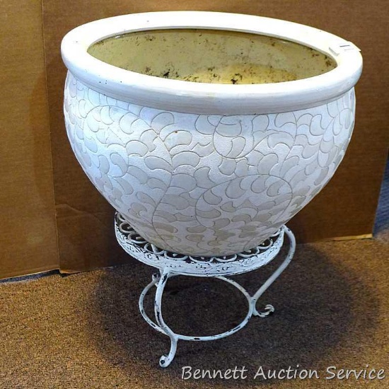 15" diameter flower pot is pottery or terra cotta with cute little stand. Total height is nearly 18"
