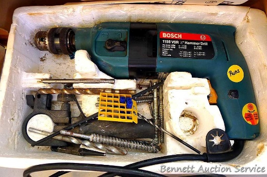 Bosch 1/2" hammer drill runs and comes with original packaging.