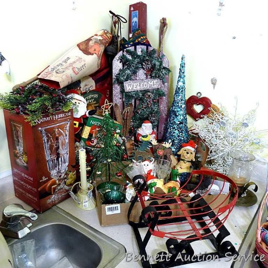 Christmas decorations including glass hurricane for candles; sparkly tree; glittery sled wall or
