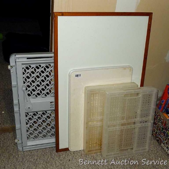 Plastic door gate expands from 25" to 41"; two dry erase boards, largest is 36" x 24"; two