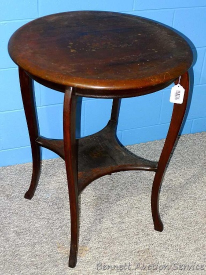 Vintage wooden table has 24" diameter top and stands 30" tall. Top is water stained, but would look