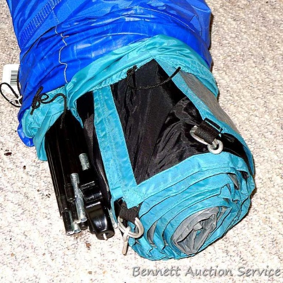 A camping tent. We didn't take this out of the bag so we don't know what size it is. Poles are