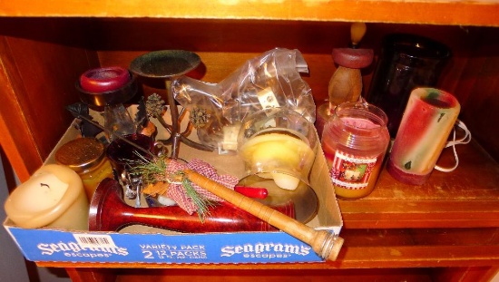 Nice bunch of candle holders, candles and a snuffer. Largest candle is 8" tall.