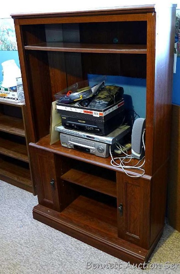 Corner entertainment center; measures 35-1/2" x 57" x 18" deep, tv opening is 32" wide. Nice little