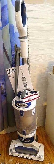 Shark Rotator NV500 vacuum cleaner with hose and attachments is 46" tall with a 12' head. Runs.