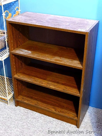 Shelving unit with 2 adjustable shelves; measures 11" x 24" x 31-1/2" tall.