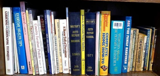 Shelf of books with a variety of subjects including health and healing, furniture projects, auto