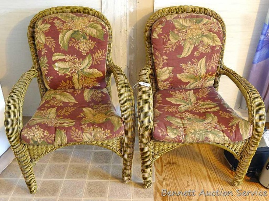 Two matching sturdy porch chairs are a larger size than most this style. Both in good shape overall