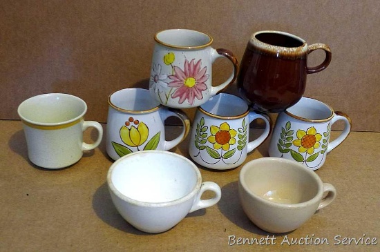 Variety of coffee mugs with 4 matching.