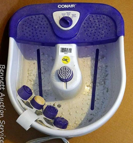 Conair foot bath includes 5 different scrubbing/massaging attachments; measures 17" x 14" x 7-1/2".