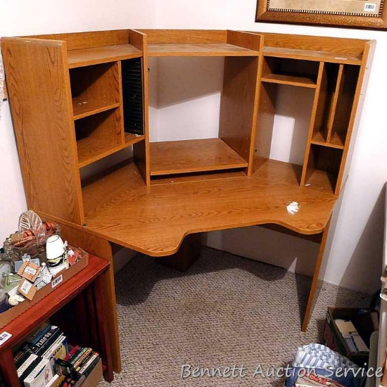 Corner style work station or desk has a lot of storage and seems in good shape. Approx. 5' across