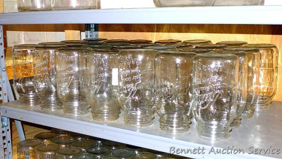 Twenty eight Kerr narrow mouth quart canning jars.