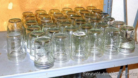 Thirty seven Kerr narrow mouth pint canning jars and one other.