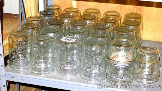 Twenty four Kerr wide mouth pint canning jars; four Kerr wide mouth half pint canning jars.