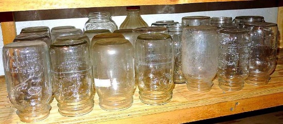 Shelf of quart narrow & wide mouth canning jars with brands Ball, Kerr, Atlas and some with no brand