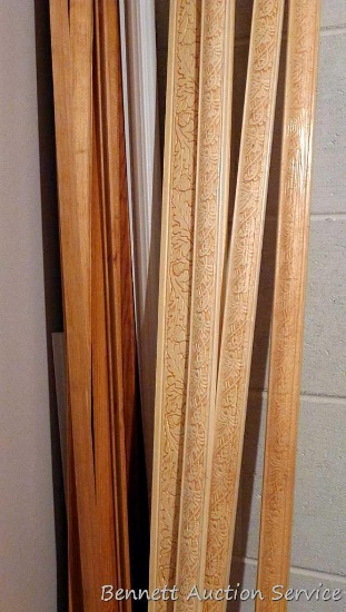 Wood and plastic trim and corner sections, most are 8 ft. long.