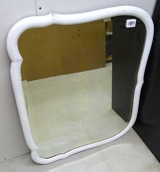 Nice beveled glass wood framed mirror measures approx. 32" x 28" over frame.