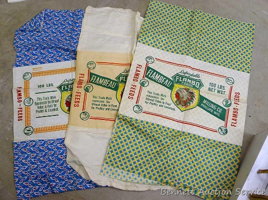 Three vintage feed sacks all from Flambeau Milling Company, Phillips, Wis and Flam-bo Feeds.