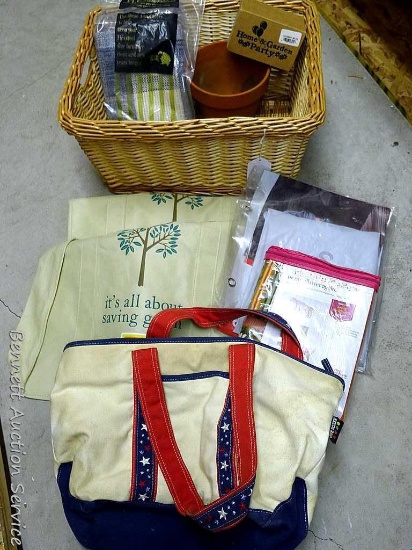 18" wide wicker basket filled with assorted cloth shopping bags, curtains, clay pot, etc.
