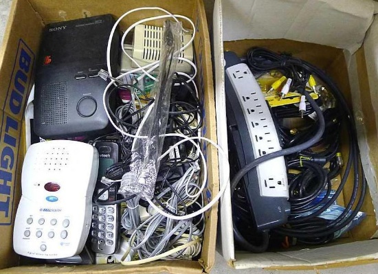 Power strip, cordless phone, answering machines, assorted cables, cords antenna and more.